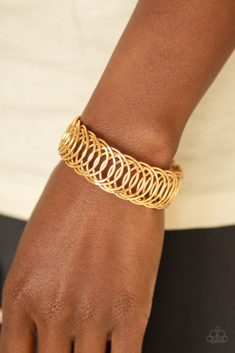 Dizzyingly Demure - Gold Bracelet